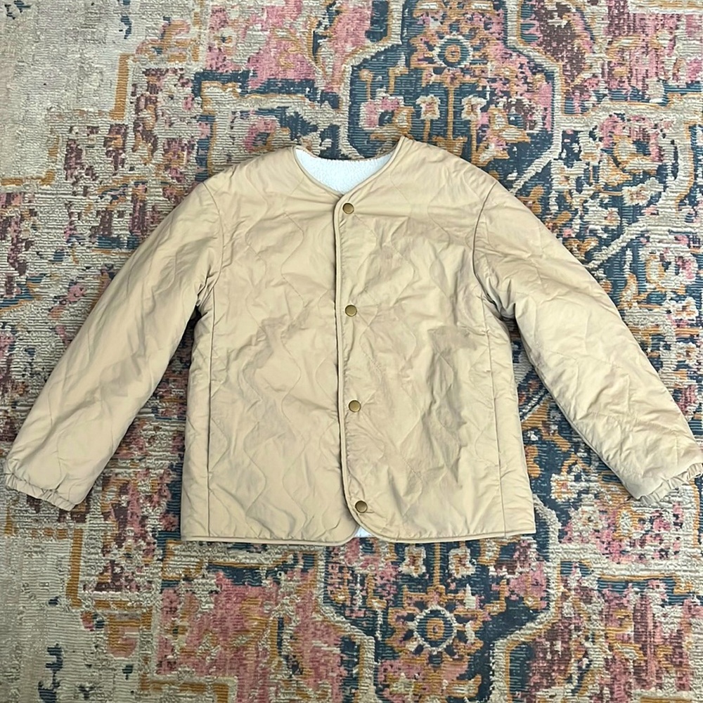 Unisex reversible quilted and deep pile fleece.